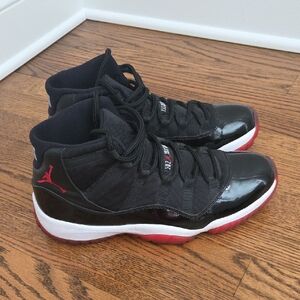 Air Jordan 11 Retro Black and Red High-Top Sneakers